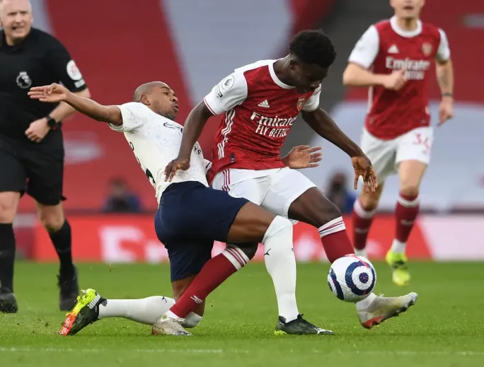 Framed Print : Clash of Titans: Bukayo Saka vs Fernandinho - Arsenal vs Manchester City, Premier League 2021: A Battle in the Empty Emirates Stadium
