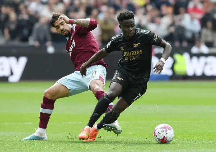 Framed Print : Clash of Titans: Bukayo Saka vs. Lucas Paqueta - West Ham United vs. Arsenal FC, Premier League 2022-23