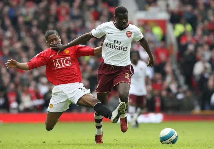 Framed Print : Clash of Titans: Eboue vs. Evra in Manchester United's 2:1 Victory over Arsenal, 2008 Framed Print : Clash of Titans: Eboue vs. Evra in Manchester United's 2:1 Victory over Arsenal, 2008