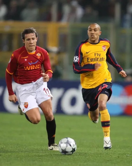 Framed Print : Clash of Titans: Gael Clichy vs. Rodrigo Taddei - Dramatic UEFA Champions League Showdown at Stadio Olympico (11 / 3 / 2009): Arsenal's Gael Clichy and Roma's Rodrigo Taddei Go Head-to-Head in a Thrilling 1:0 Second Leg Battle Decided by Penalties