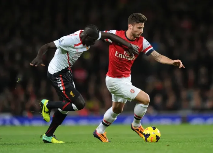 Framed Print : Clash of Titans: Giroud vs. Sakho - Arsenal vs. Liverpool, Premier League 2013-14: A Battle of Strength and Skill
