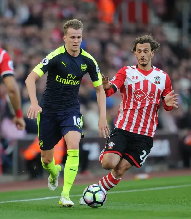 Framed Print : Clash of Titans: Holding vs. Gabbiadini - A Battle for Premier League Supremacy (Southampton vs. Arsenal, 2016-17)