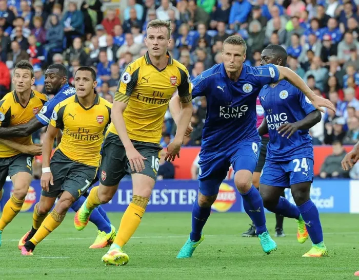 Framed Print : Clash of Titans: Holding vs. Huth - A Battle of Defenders in Leicester City vs. Arsenal, Premier League 2016-17