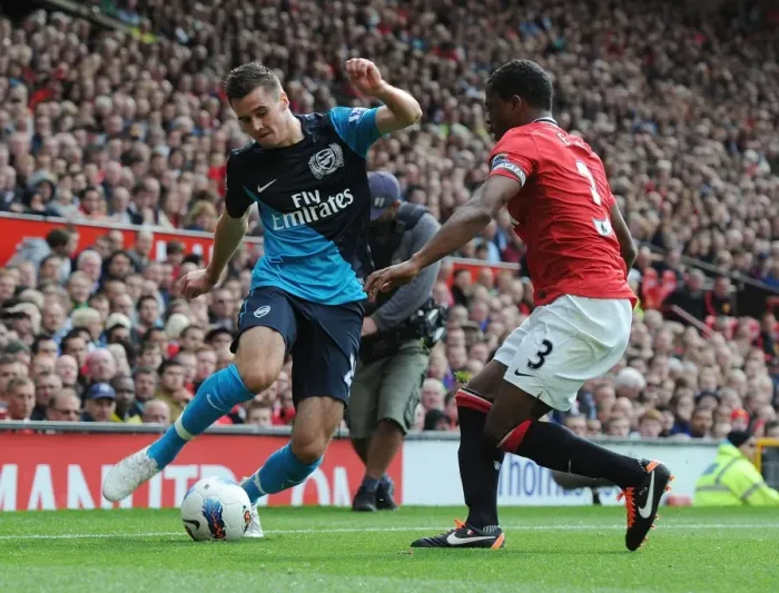 Framed Print : Clash of Titans: Jenkinson vs. Evra - Manchester United vs. Arsenal, Premier League 2011-12