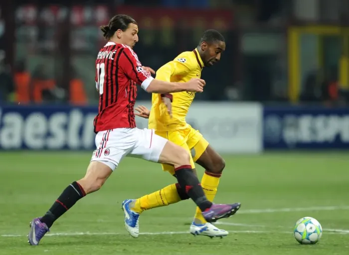 Framed Print : Clash of Titans: Johan Djourou vs Zlatan Ibrahimovic - AC Milan vs Arsenal FC, UEFA Champions League 2012
