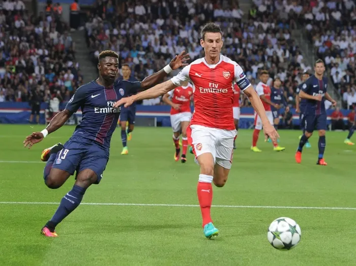 Framed Print : Clash of Titans: Koscielny vs. Aurier - Paris Saint-Germain vs. Arsenal UEFA Champions League Showdown