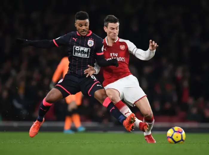 Framed Print : Clash of Titans: Koscielny vs. Kachunga - Arsenal's Premier League Showdown