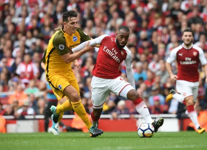 Framed Print : Clash of Titans: Lacazette vs. Dunk in Intense Arsenal vs. Brighton Premier League Showdown