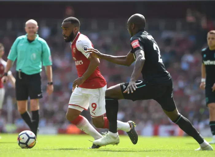 Framed Print : Clash of Titans: Lacazette vs. Ogbonna in Arsenal's Battle Against West Ham Framed Print : Clash of Titans: Lacazette vs. Ogbonna in Arsenal's Battle Against West Ham
