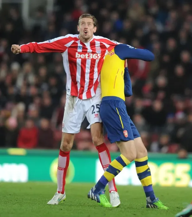 Framed Print : Clash of Titans: Mertesacker vs. Crouch - Stoke City vs. Arsenal, Premier League Framed Print : Clash of Titans: Mertesacker vs. Crouch - Stoke City vs. Arsenal, Premier League