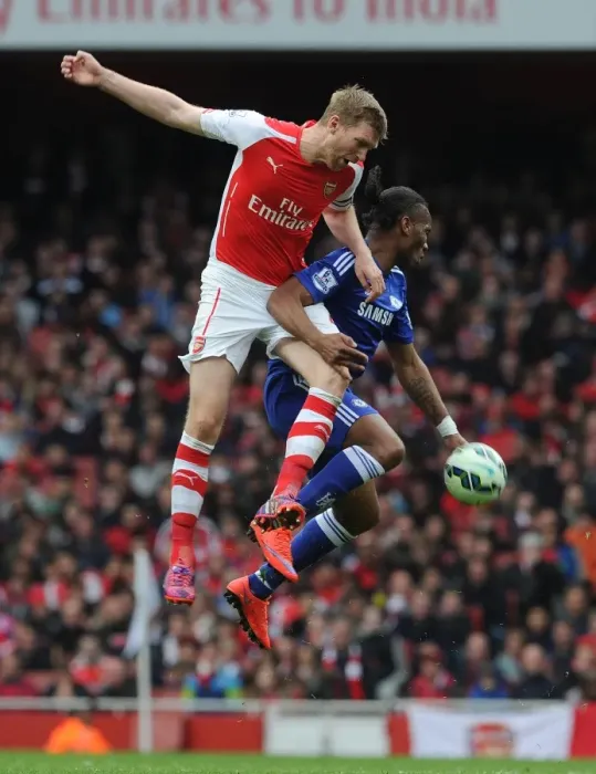 Framed Print : Clash of Titans: Mertesacker vs. Drogba - Arsenal vs. Chelsea Showdown