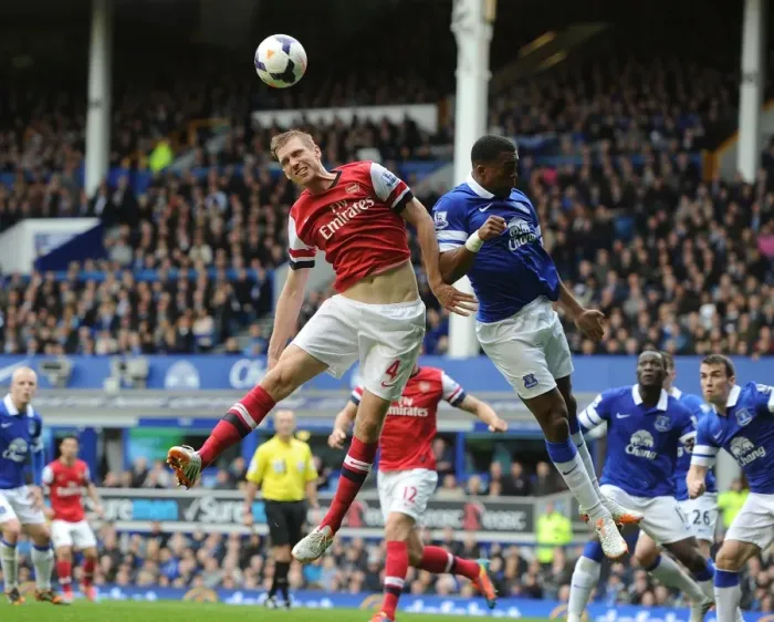 Framed Print : Clash of Titans: Per Mertesacker vs. Sylvain Distin - Everton vs. Arsenal, Premier League, 2014