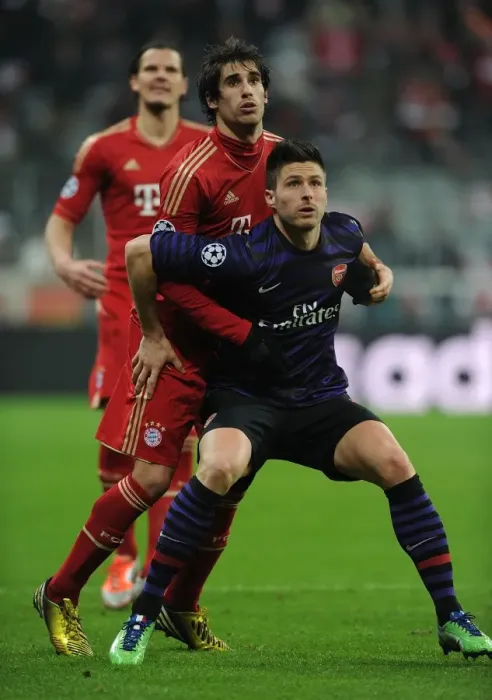 Framed Print : Clash of Titans: Olivier Giroud vs. Javi Martinez - Bayern Munich vs. Arsenal, UEFA Champions League 2013