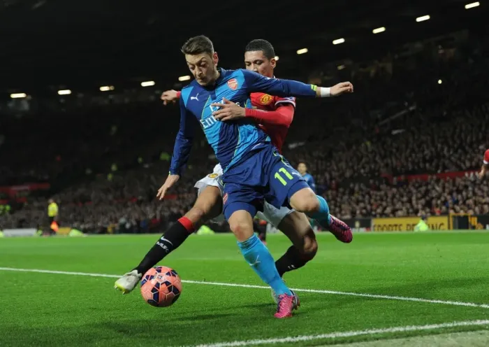Framed Print : Clash of Titans: Ozil vs. Smalling - Manchester United vs. Arsenal FA Cup Quarterfinal Framed Print : Clash of Titans: Ozil vs. Smalling - Manchester United vs. Arsenal FA Cup Quarterfinal