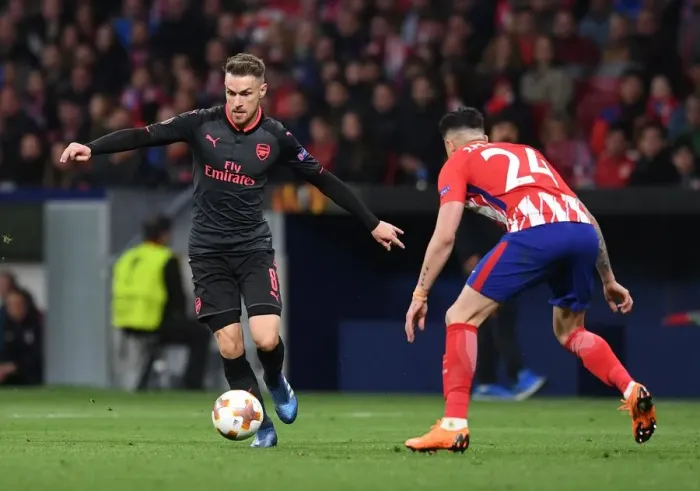 Framed Print : Clash of Titans: Ramsey vs. Gimenez in the Europa League Semi-Final Showdown