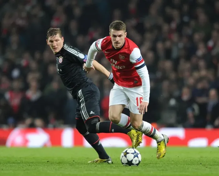 Framed Print : Clash of Titans: Ramsey vs. Schweinsteiger - Arsenal v Bayern Munich, UEFA Champions League 2013
