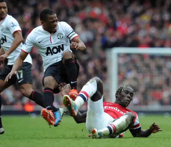 Framed Print : Clash of Titans: Sagna vs. Evra - Arsenal vs. Manchester United, Premier League, 2012-13