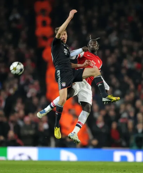 Framed Print : Clash of Titans: Sagna vs Muller in Arsenal vs Bayern Munich UEFA Champions League Showdown Framed Print : Clash of Titans: Sagna vs Muller in Arsenal vs Bayern Munich UEFA Champions League Showdown