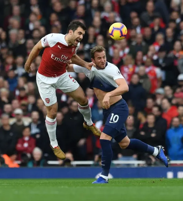 Framed Print : Clash of Titans: Sokratis vs. Harry Kane - Arsenal vs. Tottenham's Battle for Premier League Supremacy (2018-19): A Football Rivalry Ignited