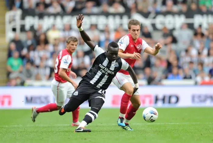 Framed Print : Clash of Titans: Tiote vs. Ramsey - Newcastle United vs. Arsenal, Premier League 2011 Framed Print : Clash of Titans: Tiote vs. Ramsey - Newcastle United vs. Arsenal, Premier League 2011