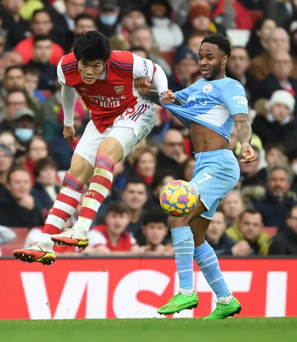 Framed Print : Clash of Titans: Tomiyasu vs Sterling - Arsenal's Unyielding Defender Stands Strong Against Manchester City's Star
