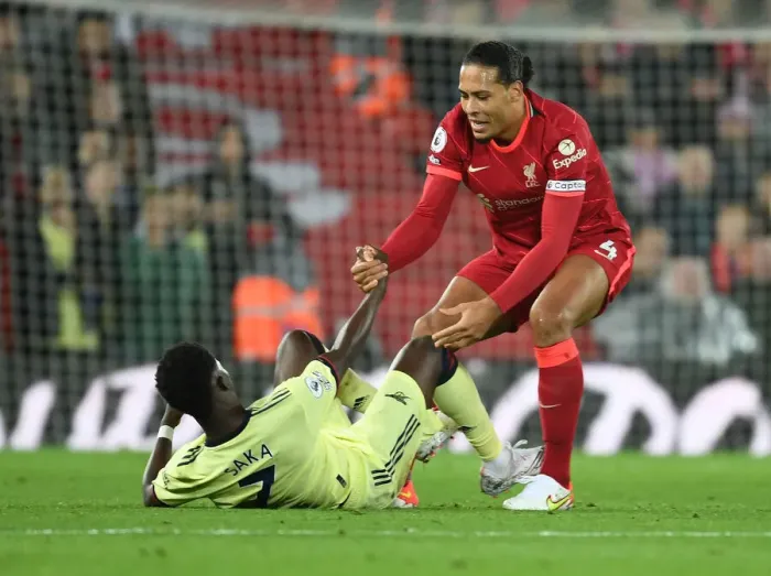 Framed Print : Clash of Titans: Van Dijk Consoles Saka Amid Intense Liverpool vs. Arsenal Rivalry (2021-22)
