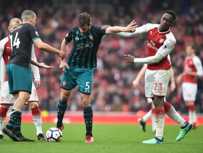 Framed Print : Clash of the Titans: Welbeck vs. Stephens in Arsenal vs. Southampton Premier League Showdown