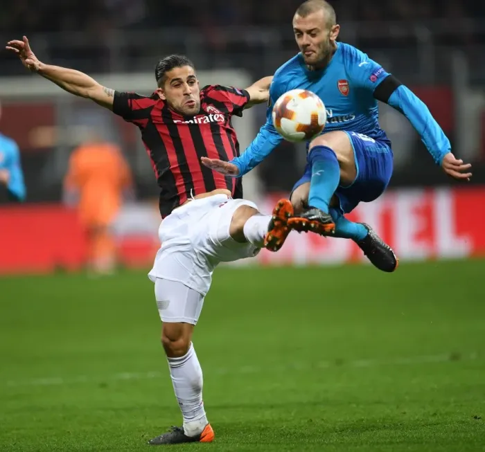 Framed Print : Clash of Titans: Wilshere vs. Rodriguez in the Europa League Showdown - Arsenal vs. AC Milan Framed Print : Clash of Titans: Wilshere vs. Rodriguez in the Europa League Showdown - Arsenal vs. AC Milan