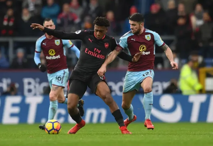 Framed Print : Clash at Turf Moor: Iwobi vs Brady in Burnley vs Arsenal Premier League Showdown Framed Print : Clash at Turf Moor: Iwobi vs Brady in Burnley vs Arsenal Premier League Showdown