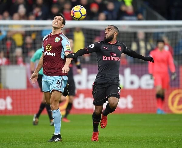 Clash at Turf Moor: Lacazette vs. Cork in the Premier League Battle between Burnley and Arsenal