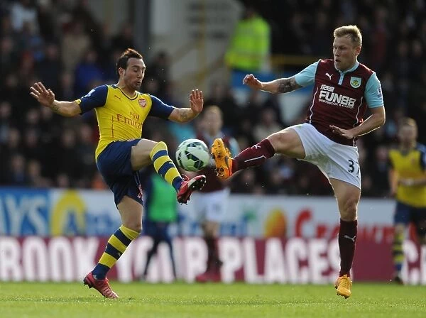 Clash at Turf Moor: Santi Cazorla vs. Ashley Barnes - Intense Battle Between Burnley and Arsenal, Premier League 2014 / 15