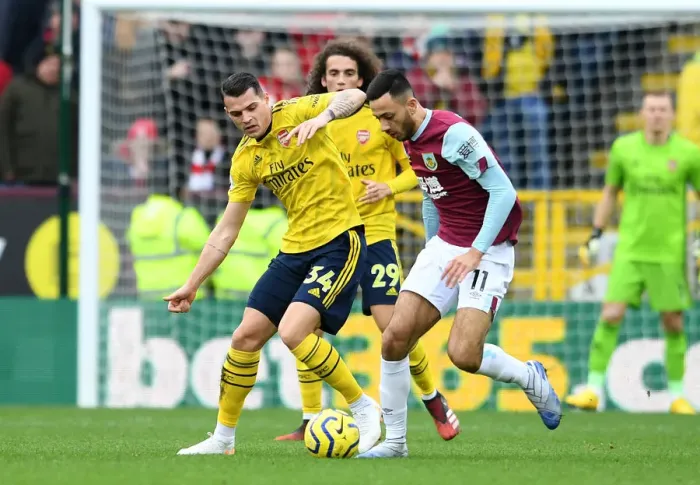 Framed Print : Clash at Turf Moor: Xhaka vs McNeill in Burnley vs Arsenal Premier League Showdown Framed Print : Clash at Turf Moor: Xhaka vs McNeill in Burnley vs Arsenal Premier League Showdown