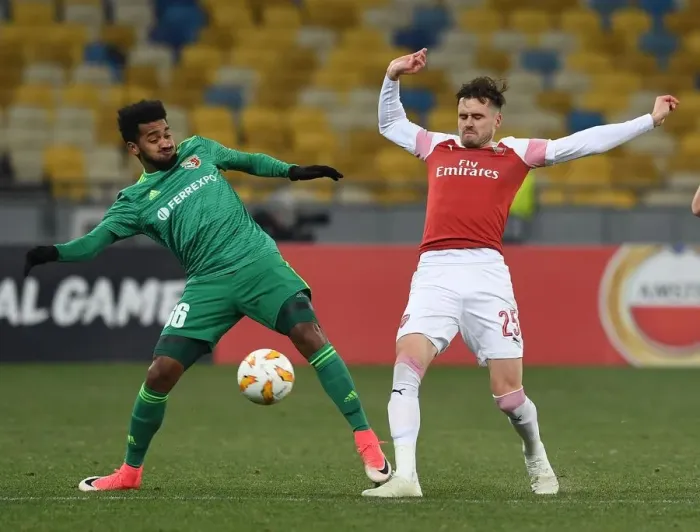 Framed Print : Clash in Ukraine: Jenkinson Faces Off Against Artur in Arsenal's Europa League Battle with Vorskla Poltava