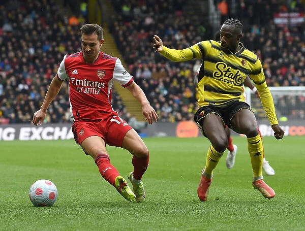 Clash at Vicarage Road: Arsenal's Cedric Soares Fends Off Hassane Kamara's Challenge (Watford vs Arsenal, Premier League 2021-22)
