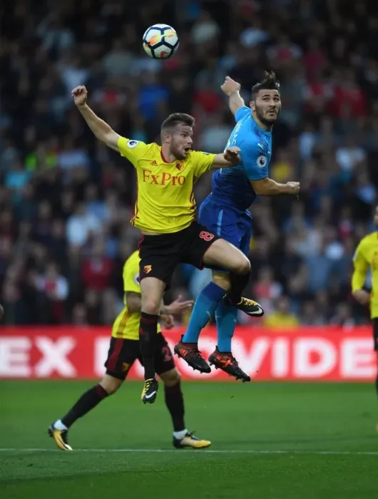 Framed Print : Clash at Vicarage Road: Kolasinac vs. Cleverley in the Premier League Showdown Framed Print : Clash at Vicarage Road: Kolasinac vs. Cleverley in the Premier League Showdown