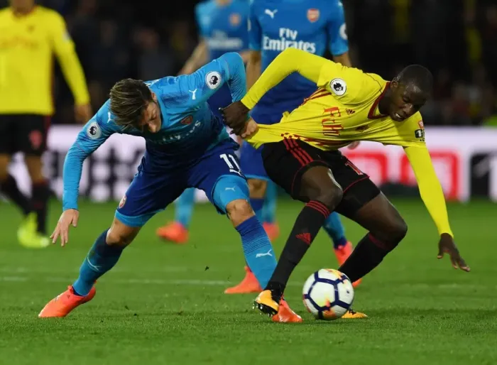Framed Print : Clash at Vicarage Road: Ozil vs. Doucoure Framed Print : Clash at Vicarage Road: Ozil vs. Doucoure