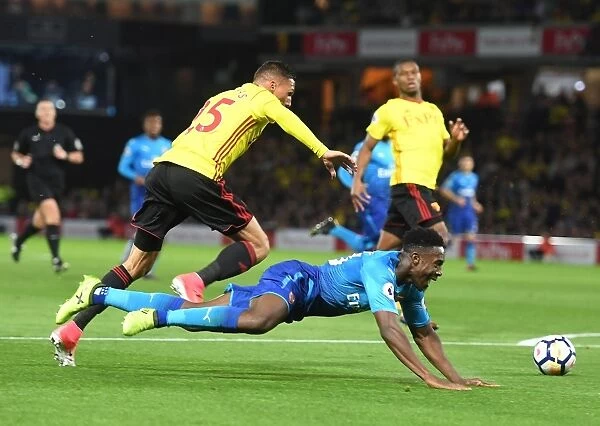 Clash at Vicarage Road: Welbeck vs. Holebas in the Premier League Battle between Watford and Arsenal