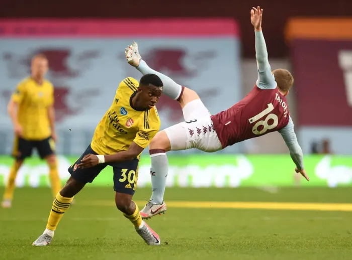Framed Print : Clash at Villa Park: Arsenal's Eddie Nketiah Faces Off Against Aston Villa's Matt Targett Framed Print : Clash at Villa Park: Arsenal's Eddie Nketiah Faces Off Against Aston Villa's Matt Targett