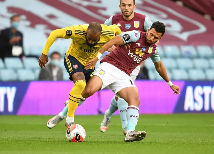 Framed Print : Clash at Villa Park: Lacazette vs. Trezeguet in Intense Aston Villa vs. Arsenal FC Premier League Showdown