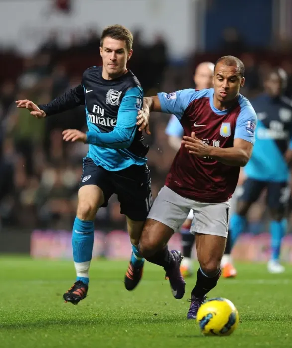 Framed Print : Clash at Villa Park: Ramsey vs Agbonlahor, Premier League Battle (2011-12) Framed Print : Clash at Villa Park: Ramsey vs Agbonlahor, Premier League Battle (2011-12)