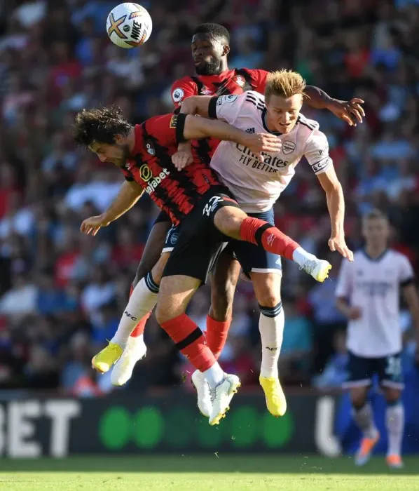 Framed Print : Clash at Vitality: Arsenal's Odegaard Faces Off Against Bournemouth's Pearson and Lerma
