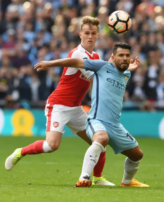 Framed Print : Clash at Wembley: Arsenal's Holding Takes on Manchester City's Aguero in FA Cup Semi-Final Showdown Framed Print : Clash at Wembley: Arsenal's Holding Takes on Manchester City's Aguero in FA Cup Semi-Final Showdown