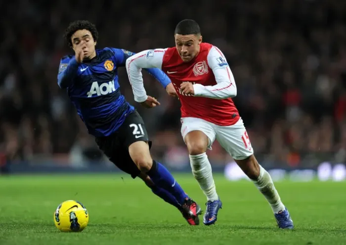 Framed Print : Clash of Wings: Oxlade-Chamberlain vs. Rafael at the Emirates Framed Print : Clash of Wings: Oxlade-Chamberlain vs. Rafael at the Emirates