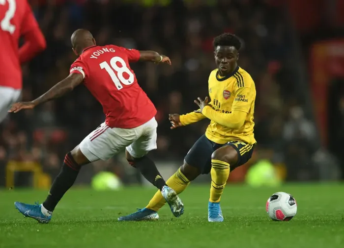 Framed Print : Clash of Wings: Saka vs Young - Premier League Showdown (2019-20) - Manchester United vs Arsenal Framed Print : Clash of Wings: Saka vs Young - Premier League Showdown (2019-20) - Manchester United vs Arsenal