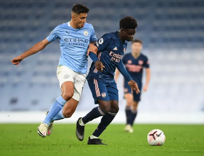 Framed Print : Clash of Young Titans: Bukayo Saka vs Rodrigo - Manchester City vs Arsenal, Premier League 2020-21 (Empty Etihad Stadium) Framed Print : Clash of Young Titans: Bukayo Saka vs Rodrigo - Manchester City vs Arsenal, Premier League 2020-21 (Empty Etihad Stadium)