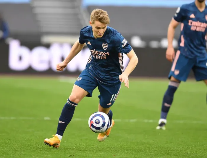 Framed Print : Behind Closed Doors: Martin Odegaard Leads Arsenal Past West Ham in Empty London Stadium