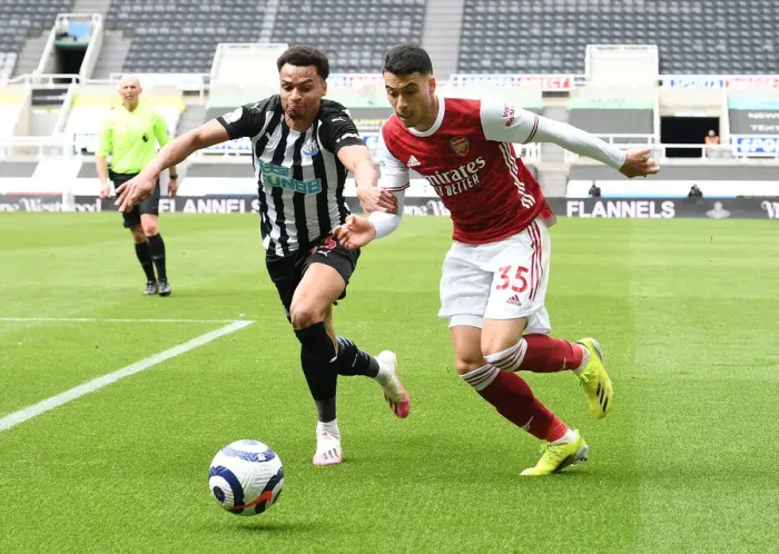 Framed Print : Behind Closed Doors: Martinelli vs. Murphy Clash - Arsenal's Battle at Newcastle, Premier League 2021