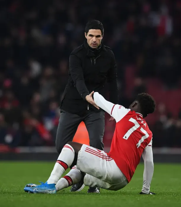 Framed Print : Comfort and Courage: Mikel Arteta Consoles Distressed Bukayo Saka After Arsenal's Defeat