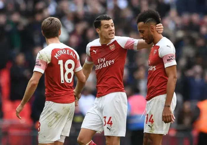 Framed Print : Consolation: Xhaka Comforts Aubameyang After Arsenal's Loss to Tottenham