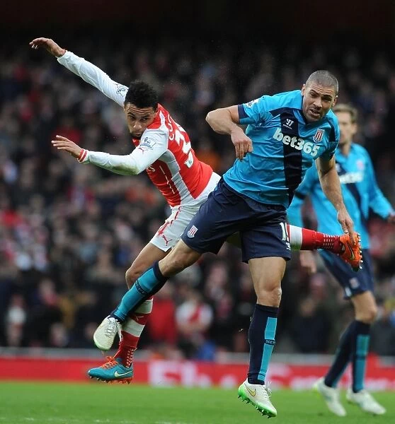 Coquelin Closes In: Intense Battle Between Arsenal's Francis Coquelin and Stoke City's Jonathan Walters